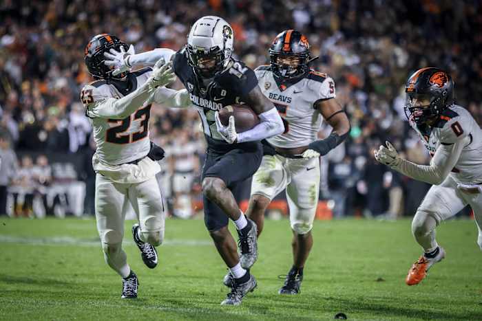 Colorado Buffaloes cornerback Travis Hunter (12) breaks past Oregon State Beavers defensive back Jermod McCoy (23) at Folsom Field
